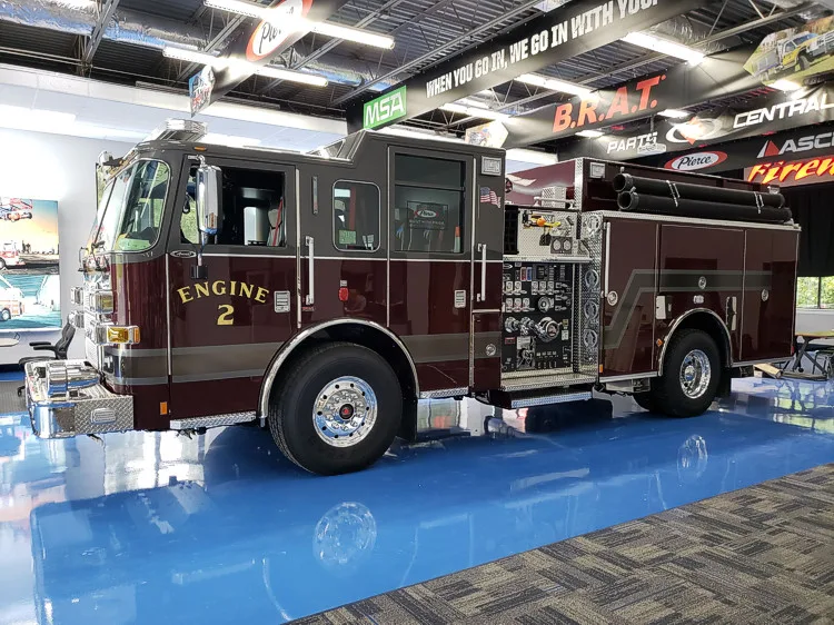 Driver-side profile showing pumper body and side compartments