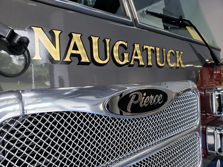 Front grille close-up showing Naugatuck lettering and Pierce badge