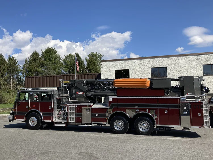 Driver-side profile view showing ladder body and rear wheelbase