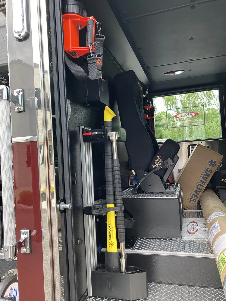 Open rear crew area showing cone and mounted long tools