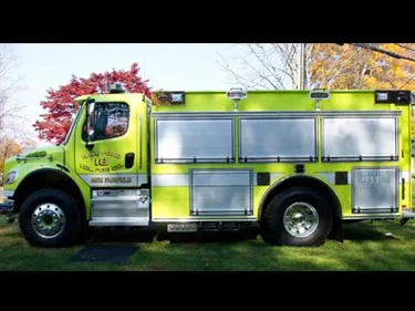 Full left-side profile showing compartment layout, wheel area, and low side intake panel.