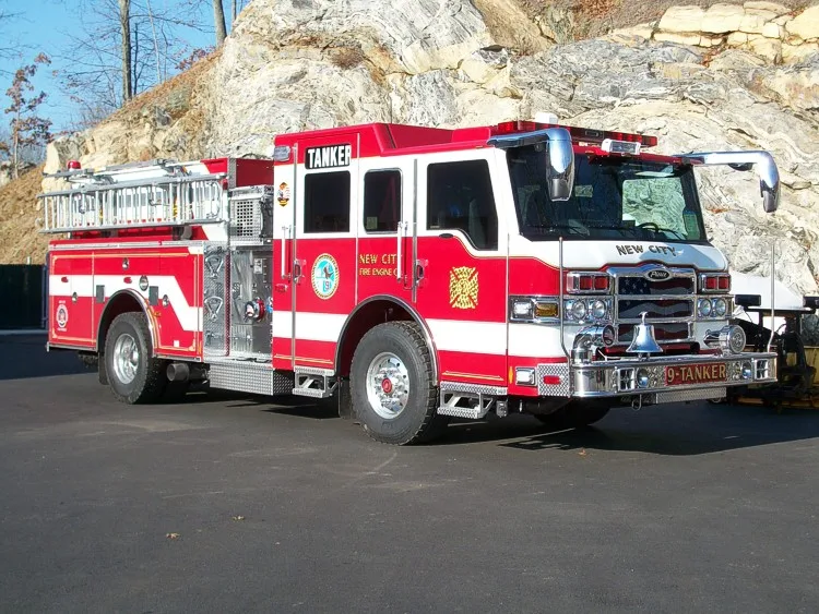 Front-right exterior view showing the cab face, side pump panel section, and rear body.