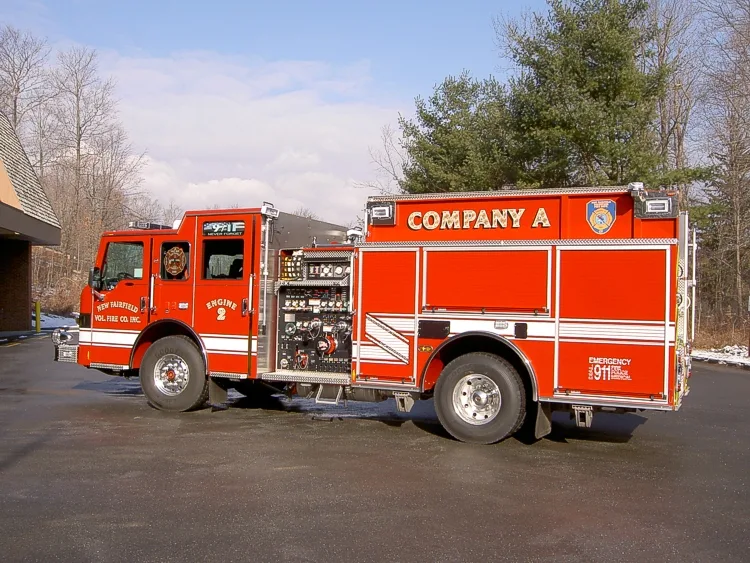 Passenger-side rear three-quarter view showing rear body and side compartments