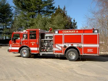 Driver-side profile view showing side compartments and wheel area