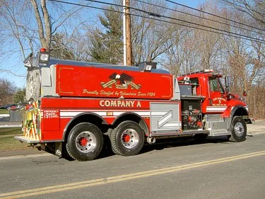 Passenger-side full profile showing polished tank body and side pump area