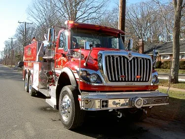 Front-right exterior view showing grille, bumper, and wheel area