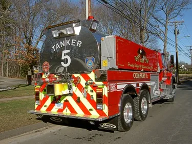 Rear-right exterior close-up showing Tanker 5 rear panel and discharge fittings