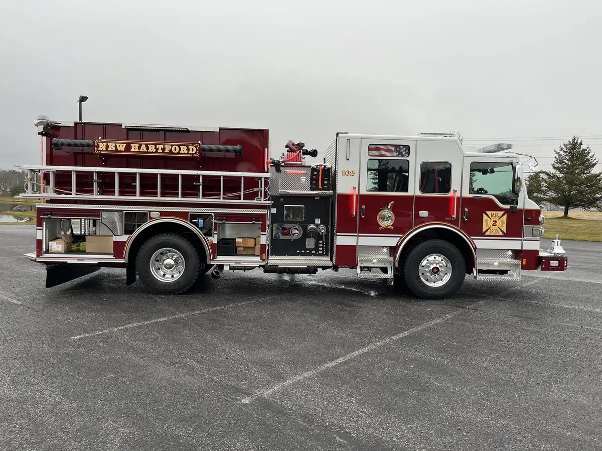 Officer-side full profile view showing side pump panel and pumper body