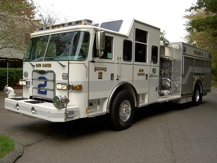 Front-left exterior view showing bumper, cab, and long body