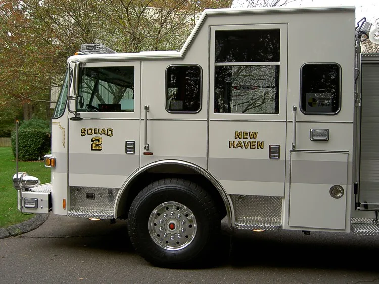 Cab side close-up showing doors, side windows, and front wheel area