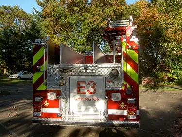 Rear view showing chevron striping, rear panel, and warning lights