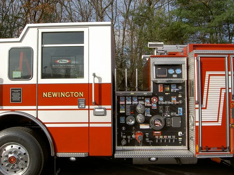 Close-up of the pump panel with gauges, valve controls, discharges, and electronic readouts.
