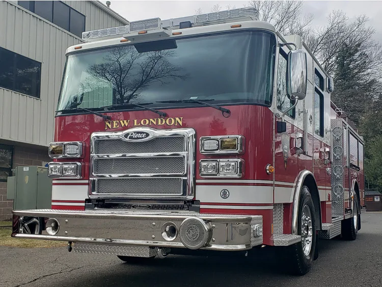 Head-on front view showing grille, bumper, and warning lights