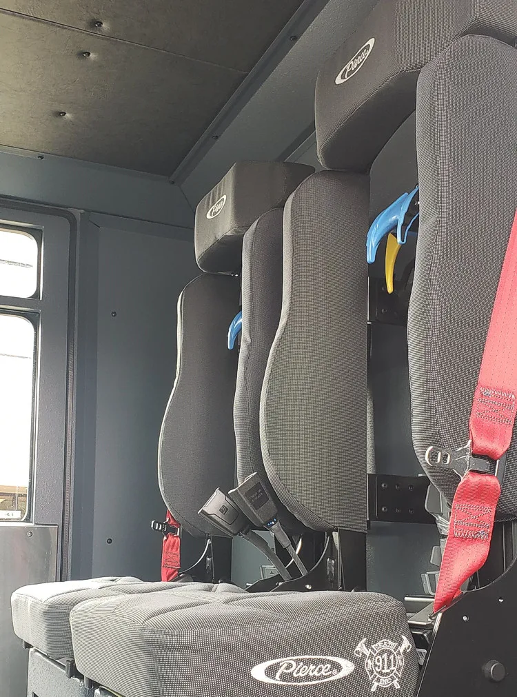 Cab interior side view showing seat back and side trim panel