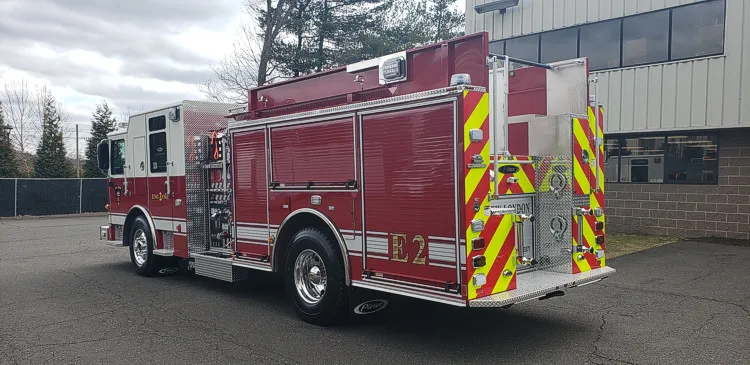Rear-left exterior view showing side body and rear chevron striping