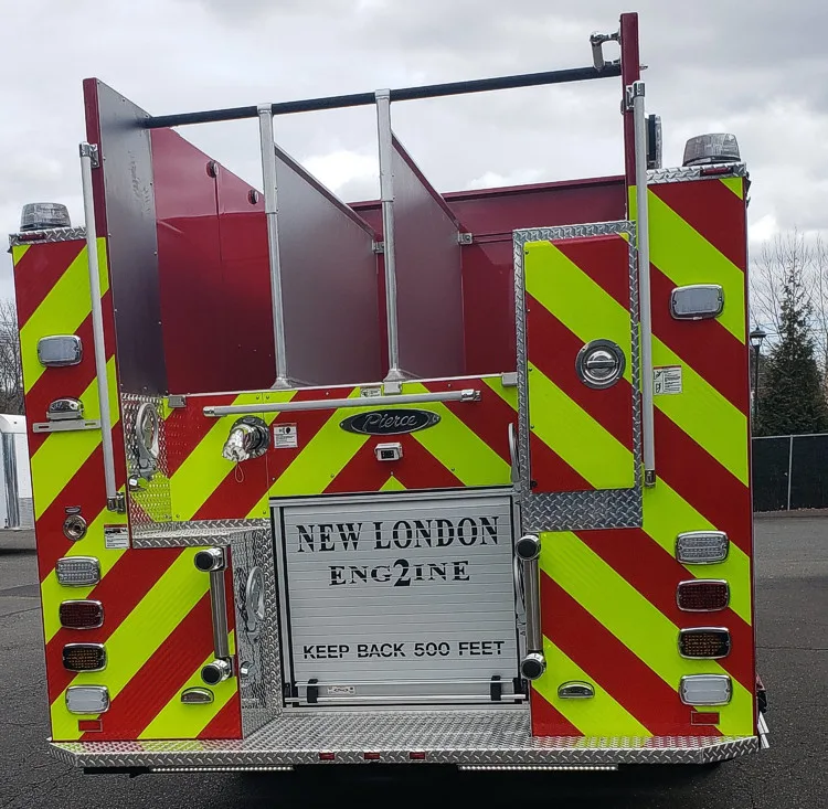Rear view showing chevrons, rear lights, and hosebed area