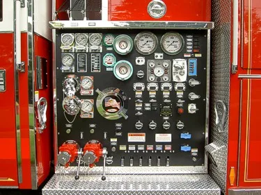 Pump panel close-up showing gauge cluster and control handles