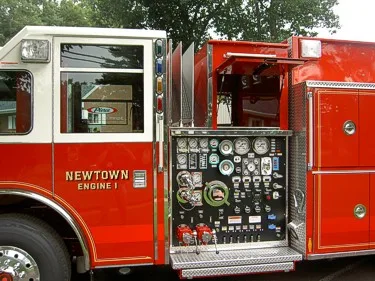 Pump panel close-up showing gauges, valves, and intake controls