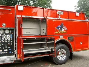 Open side compartment view showing pull-out shelves and storage tray