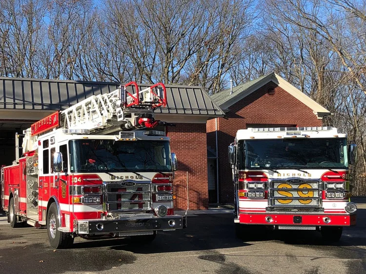 Two-apparatus front view showing grilles, bumpers, and warning lights