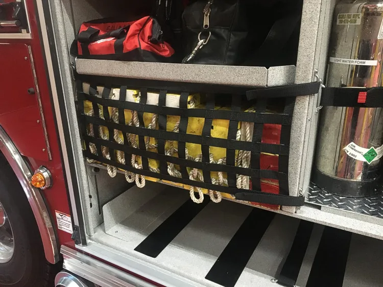 Open side compartment showing mounted equipment bag and storage tray