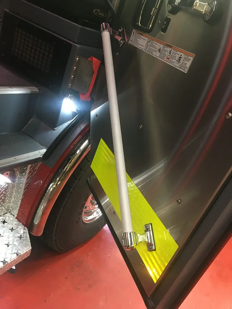 Cab step area close-up showing fold-out step and lower body panel