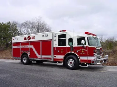 Driver-side profile view showing long body and side striping