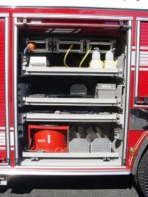Open side compartment showing shelves with buckets and loose equipment