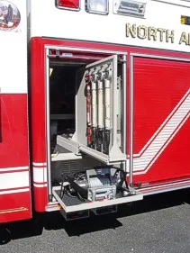 Open lower side compartment showing slide-out tray and mounted bracket