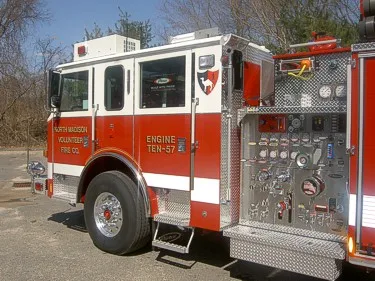 Pump panel close-up showing gauges, valves, and control fittings