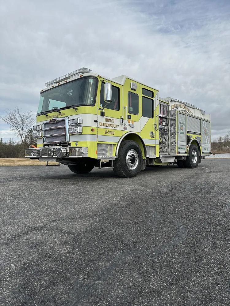 Front-right exterior view showing cab profile and side pump panel section