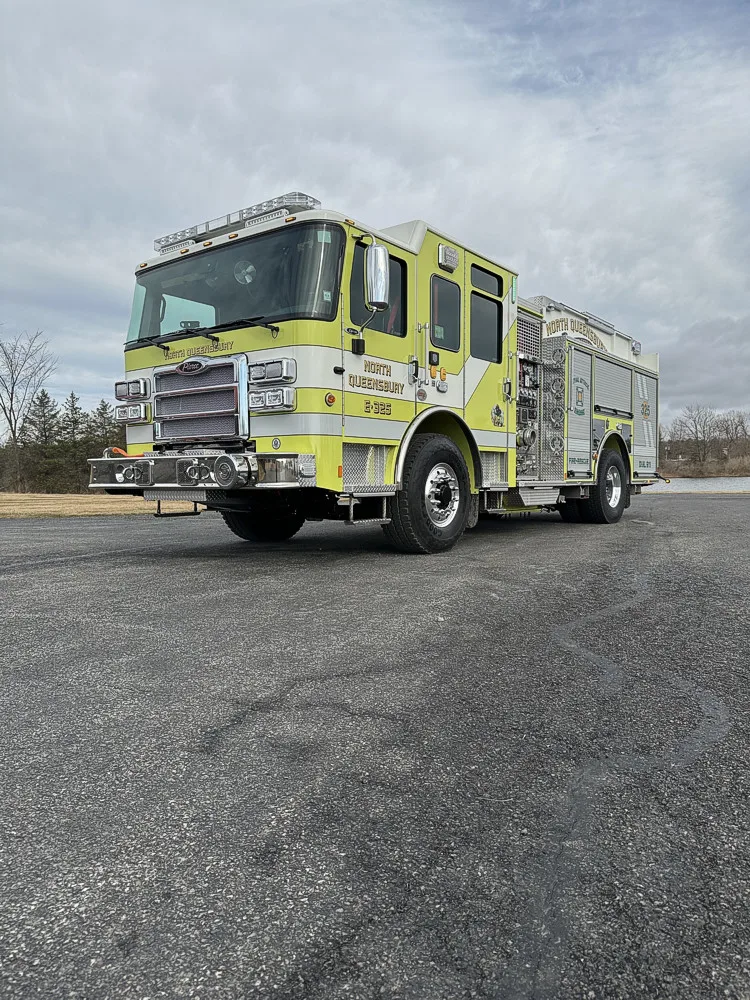 Front-right exterior view highlighting bumper, front wheel, and side body