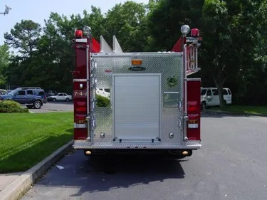 Rear view showing rear panel, warning lights, and lower step