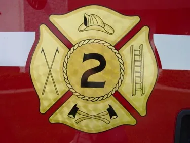 Door emblem close-up showing shield logo on red side panel