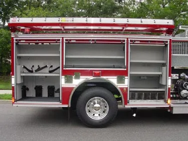 Driver-side profile with open side compartments showing shelf storage