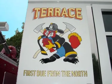 Body panel close-up showing cartoon-style mascot graphic and lettering