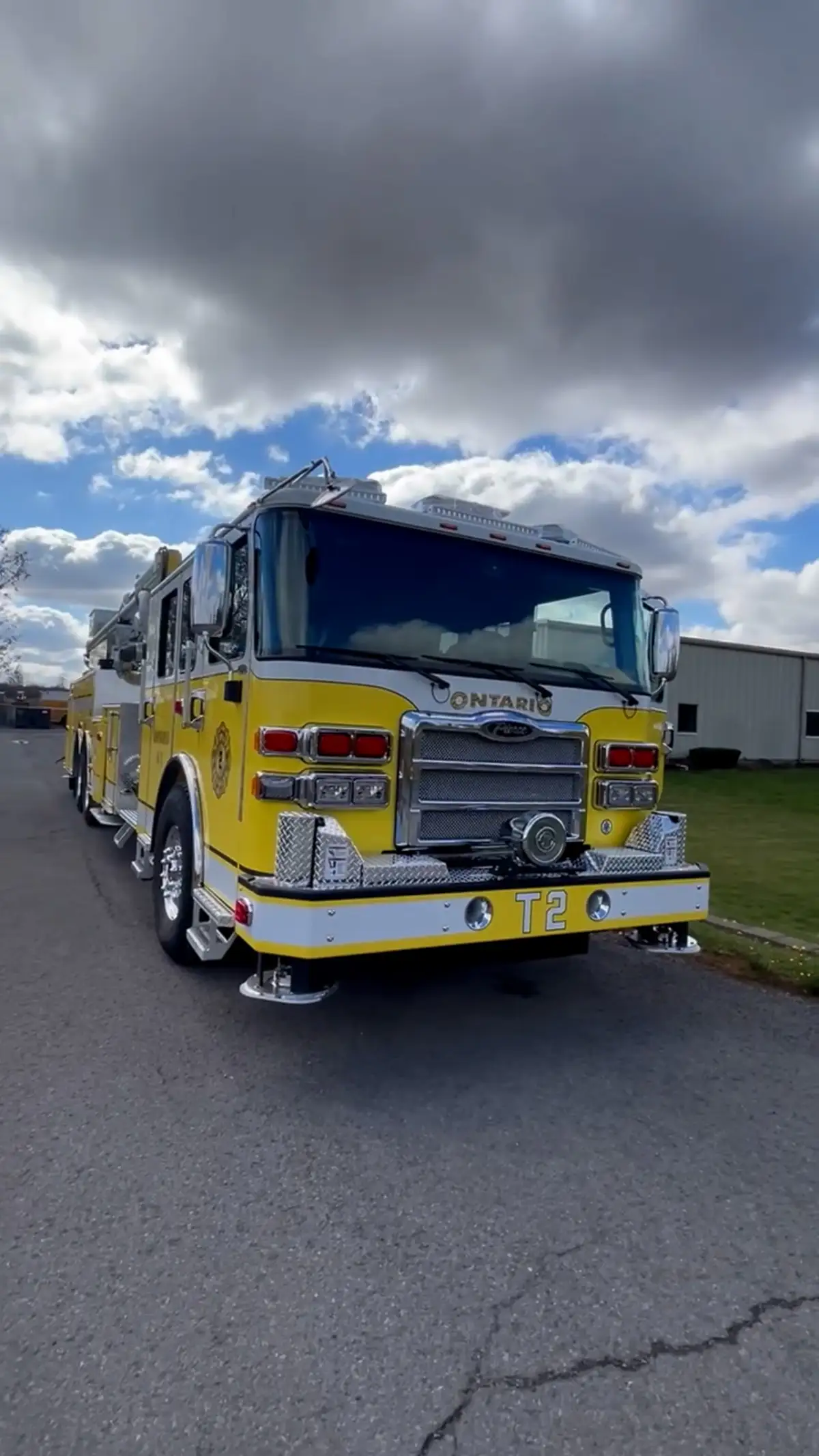 Head-on front view showing grille, bumper intakes, and warning lights