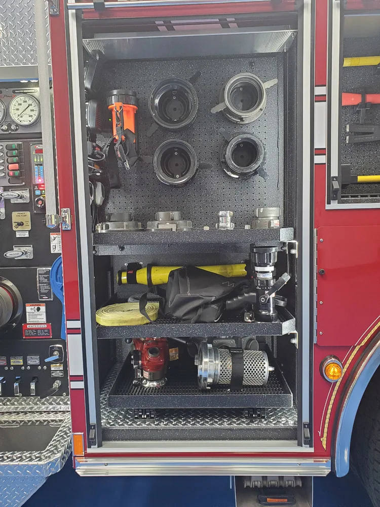 Pump panel close-up showing gauges, valves, and labeled controls