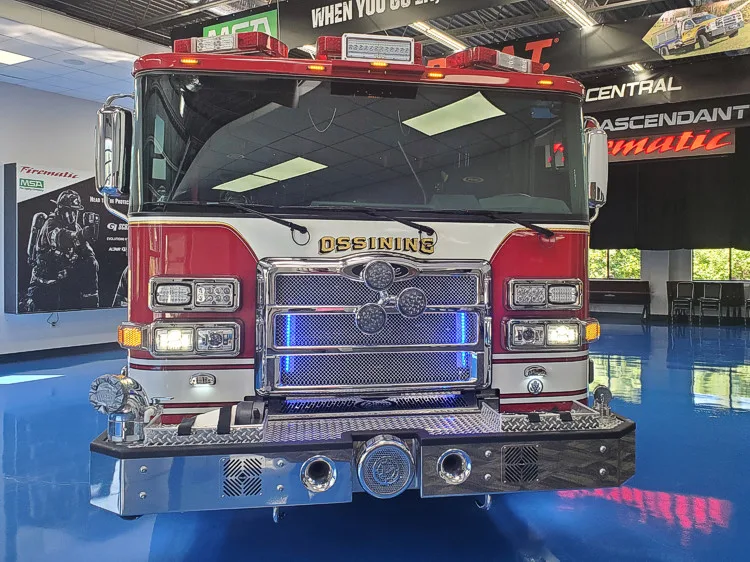 Head-on front view showing grille, bumper intakes, and warning lights