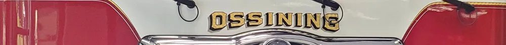 Front grille close-up strip showing raised Ossining script and Pierce badge