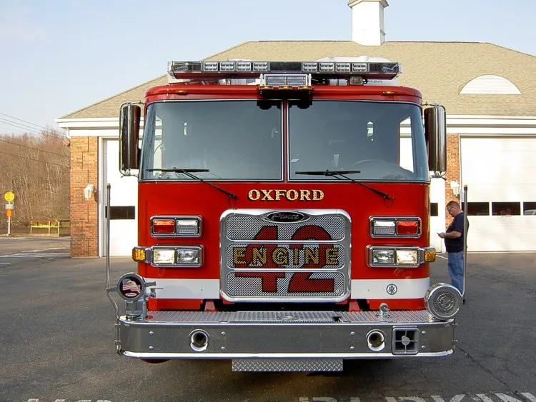 Front exterior view showing grille, bumper, and warning lights