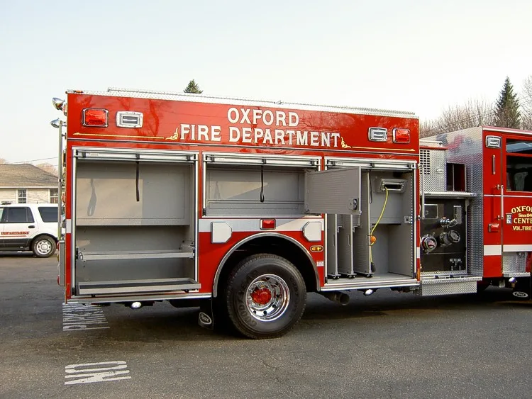 Driver-side profile with open compartments showing storage bays