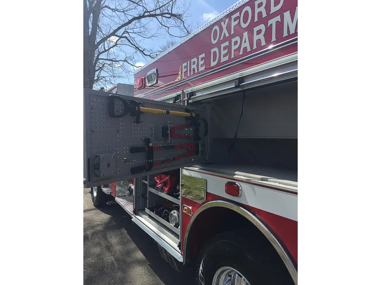 Extended swing-out tool board showing mounted hand tools beside open compartment