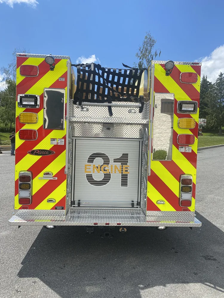 Rear view showing red-and-yellow chevrons and rear center panel