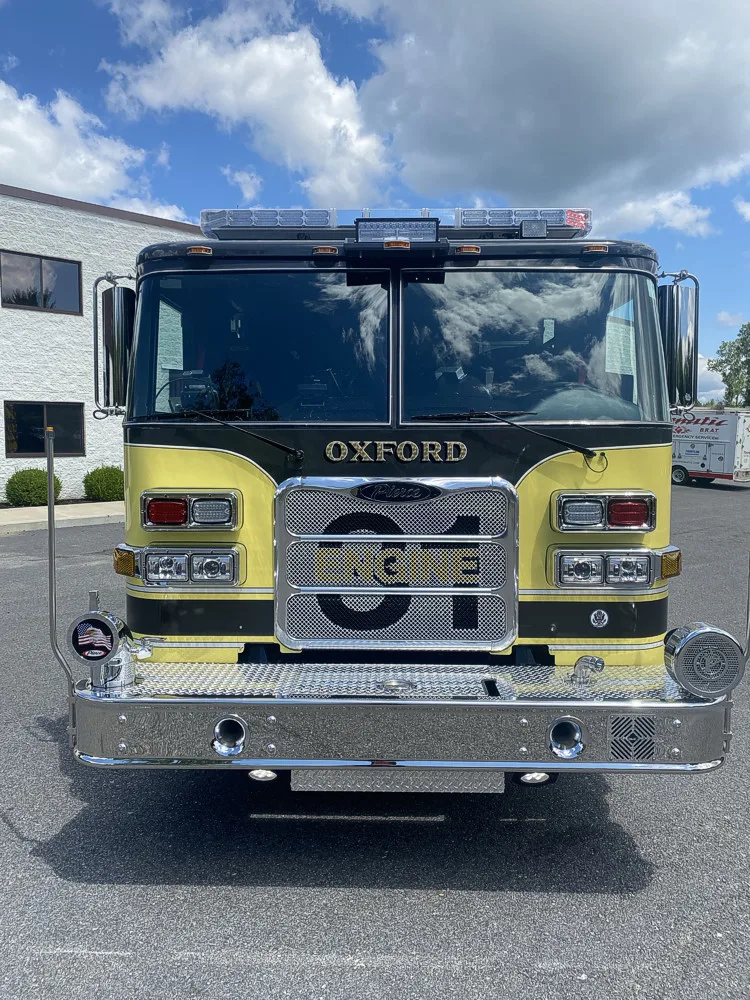Head-on front view showing grille and cab from low angle