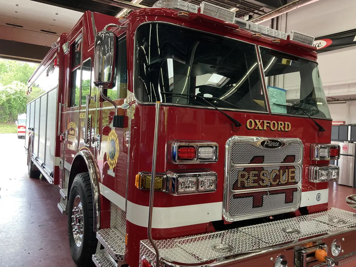 Front-left exterior view showing cab corner, grille, and bumper