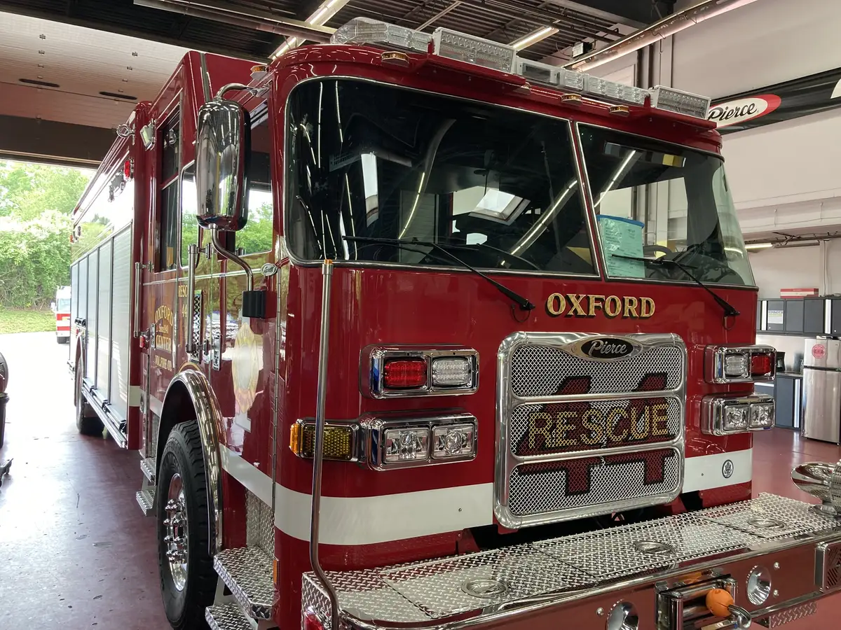 Front-left exterior close view showing grille, bumper, and cab