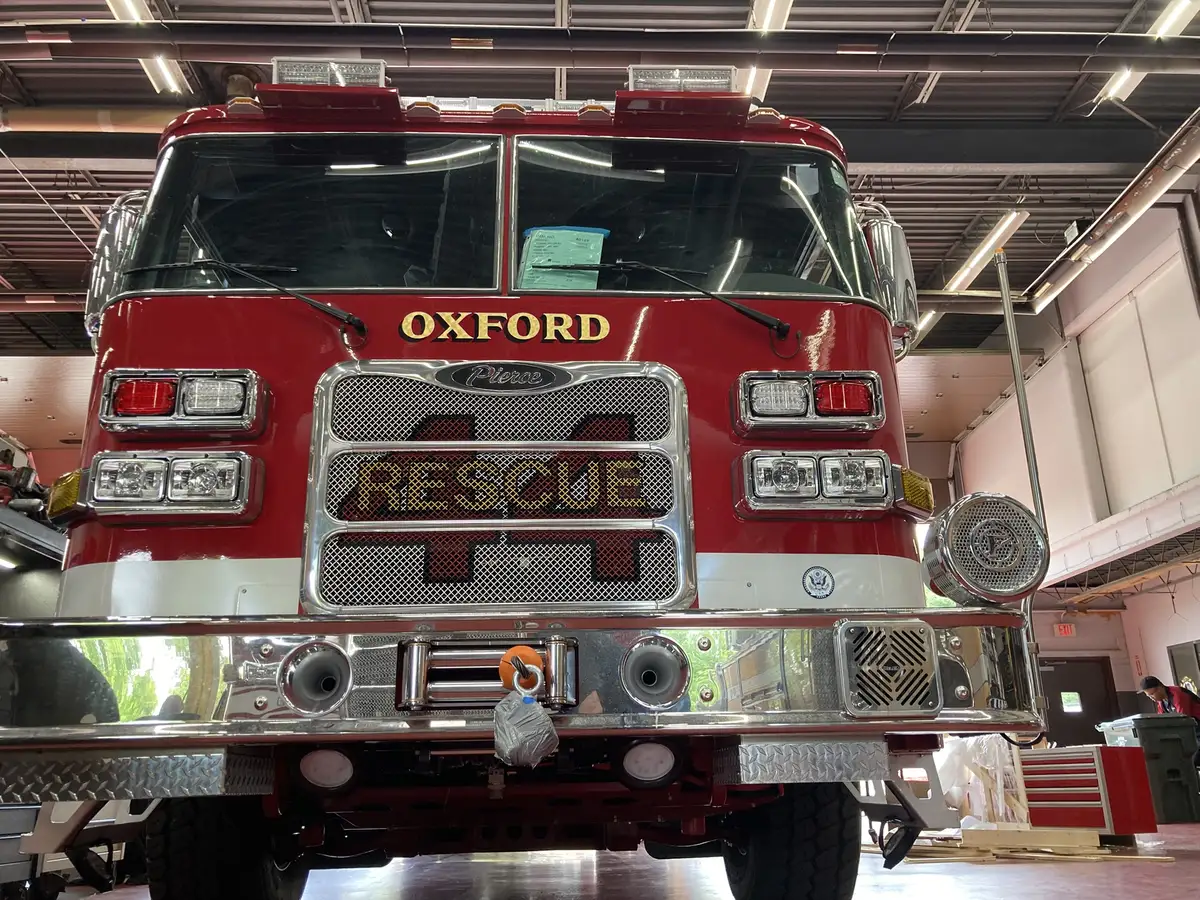 Head-on front view showing grille, warning lights, and bumper intakes