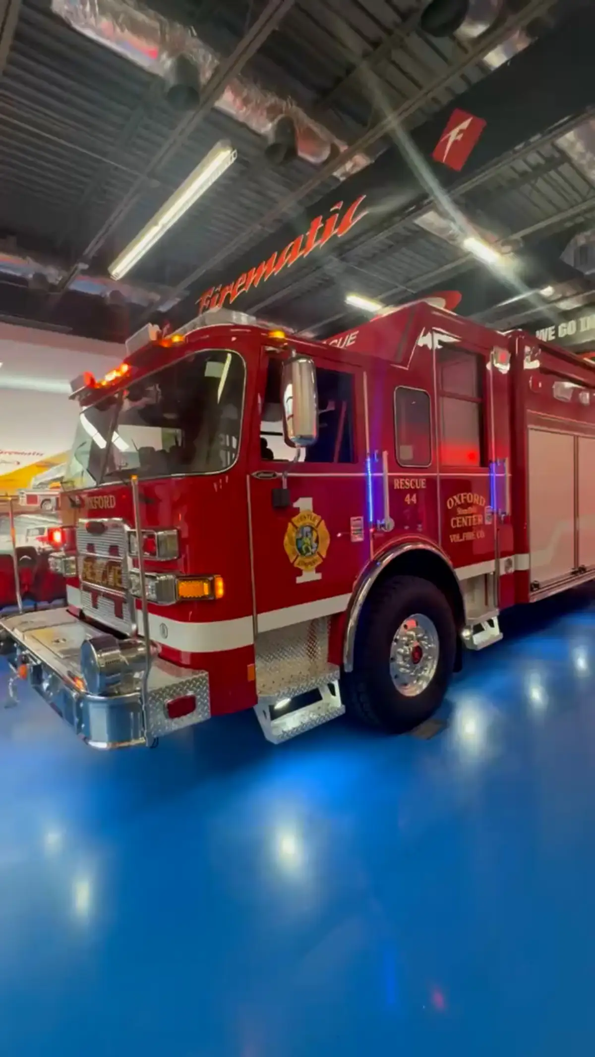 Front-right exterior view with warning lights illuminated and side body visible