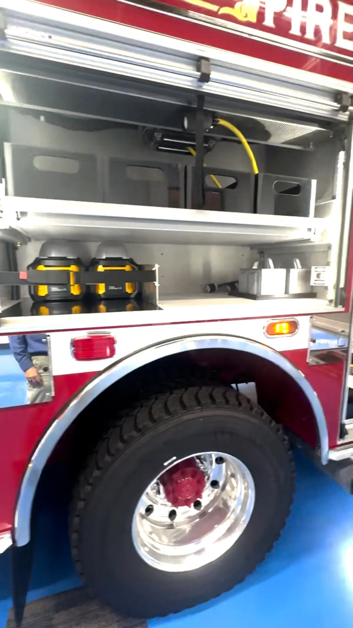 Open side compartment above rear wheel showing shelf storage and wheel arch